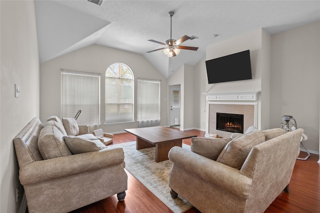 12835 Cambridge Eagle Dr, Houston, TX 77044 - living area featuring ceiling fan, wood finished floors, a fireplace, lofted ceiling, and baseboards