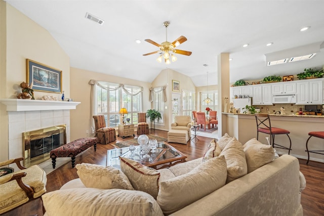 12938 Quail Park Dr, Cypress, TX 77429 - living area featuring ceiling fan, a fireplace, lofted ceiling, dark wood-type flooring, and recessed lighting