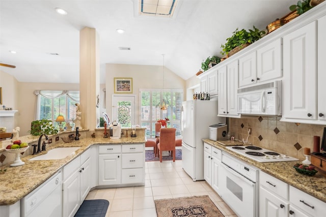 12938 Quail Park Dr, Cypress, TX 77429 - kitchen with white appliances, a sink, backsplash, white cabinets, and light tile patterned floors