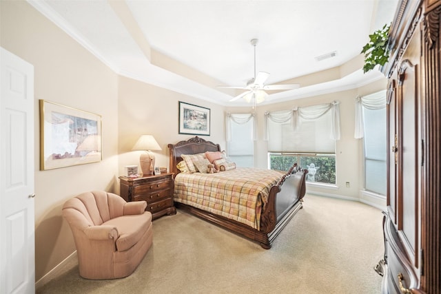 12938 Quail Park Dr, Cypress, TX 77429 - bedroom featuring light carpet, crown molding, a raised ceiling, baseboards, and ceiling fan