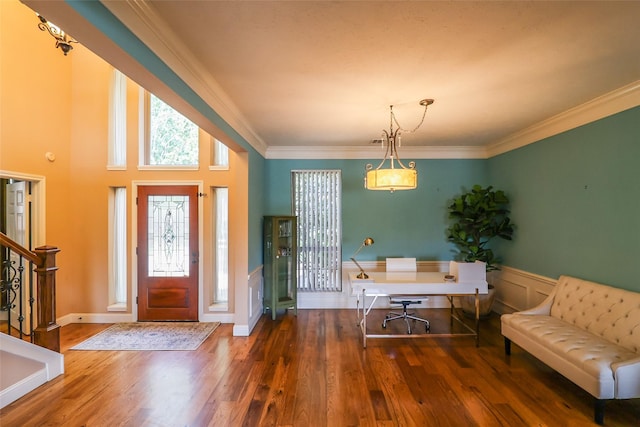 101 N Hall Dr, Sugar Land, TX 77478 - foyer featuring wood finished floors, ornamental molding, a wainscoted wall, and stairs