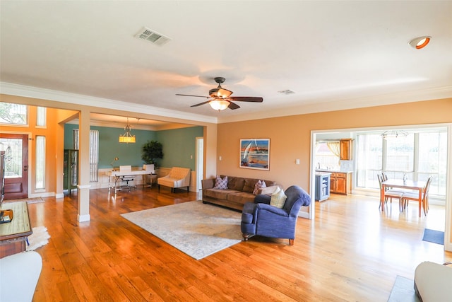 101 N Hall Dr, Sugar Land, TX 77478 - living area with ornamental molding, light wood finished floors, and a ceiling fan