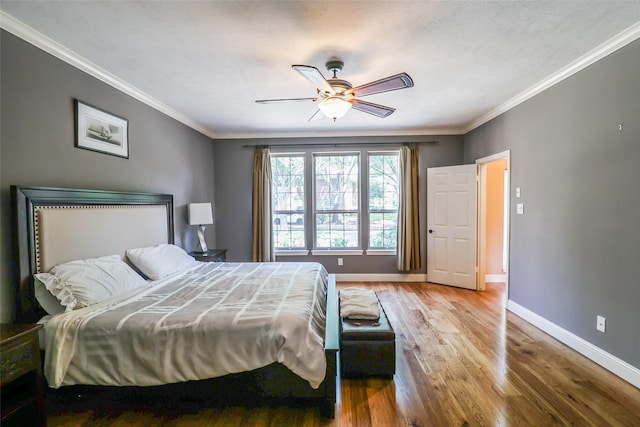 101 N Hall Dr, Sugar Land, TX 77478 - bedroom featuring baseboards, wood finished floors, crown molding, and ceiling fan