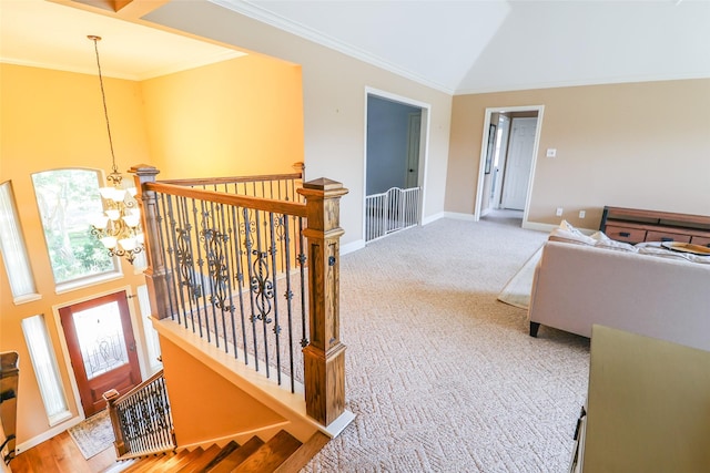 101 N Hall Dr, Sugar Land, TX 77478 - hall with an upstairs landing, a chandelier, crown molding, carpet floors, and baseboards
