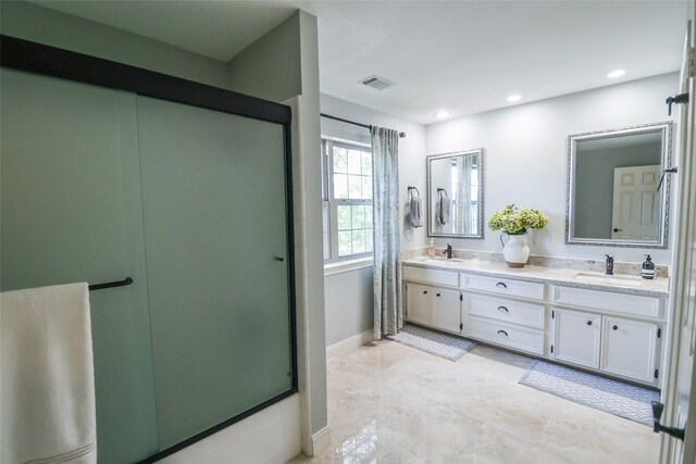 101 N Hall Dr, Sugar Land, TX 77478 - full bath featuring a stall shower, double vanity, recessed lighting, and baseboards