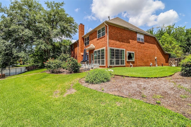 101 N Hall Dr, Sugar Land, TX 77478 - back of property featuring brick siding and a chimney