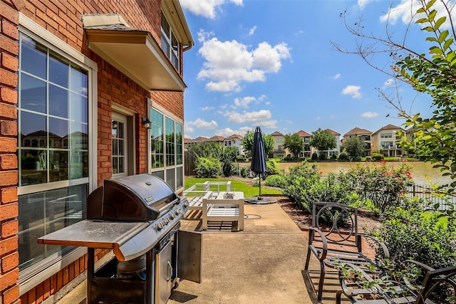 101 N Hall Dr, Sugar Land, TX 77478 - view of patio / terrace featuring fence, a residential view, and a grill