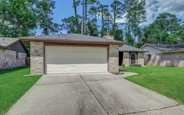 view of front of home with a garage, brick siding, a chimney, and a front yard