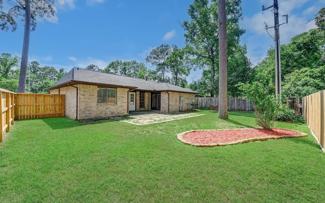 back of property featuring brick siding and a patio