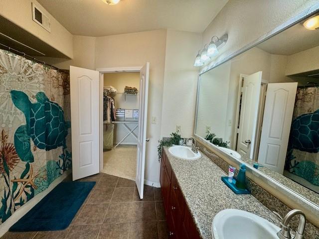1711 Old Spanish Trl Unit 323, Houston, TX 77054 - full bath featuring tile patterned floors and double vanity