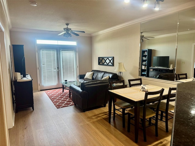 1711 Old Spanish Trl Unit 323, Houston, TX 77054 - living room with a ceiling fan, wood finished floors, and ornamental molding