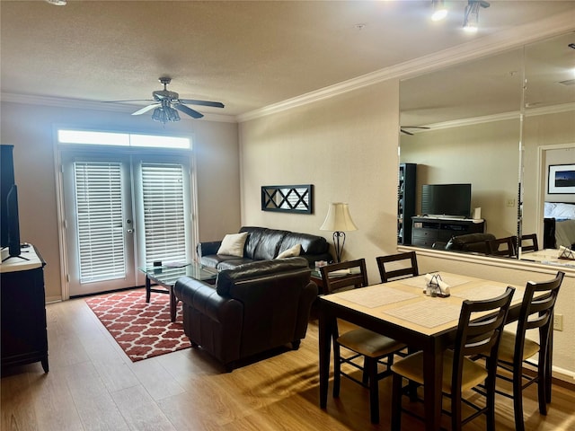 1711 Old Spanish Trl Unit 323, Houston, TX 77054 - dining room featuring ceiling fan, wood finished floors, and ornamental molding