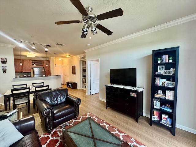 1711 Old Spanish Trl Unit 323, Houston, TX 77054 - living area featuring ceiling fan, crown molding, light wood finished floors, baseboards, and a textured ceiling