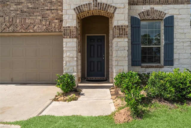 247 Pine Cavern Dr, Willis, TX 77378 - property entrance featuring stone siding and an attached garage
