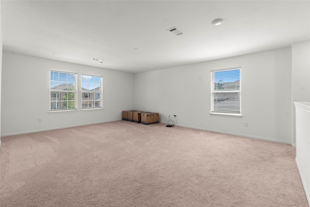 247 Pine Cavern Dr, Willis, TX 77378 - unfurnished room with healthy amount of natural light, light colored carpet, and baseboards