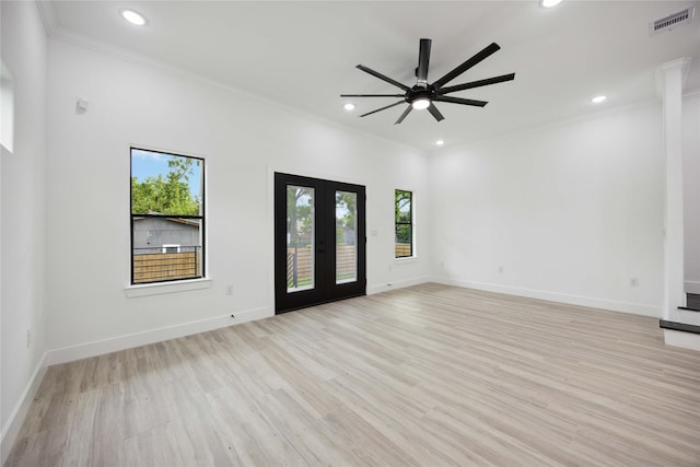 unfurnished living room with a ceiling fan, recessed lighting, french doors, ornamental molding, and light wood-style flooring