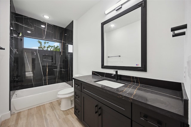 full bathroom with toilet, vanity, shower / tub combination, and recessed lighting