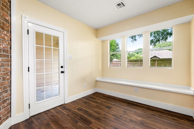 1408 Quail Holw, Sealy, TX 77474 - entryway featuring dark wood finished floors and baseboards