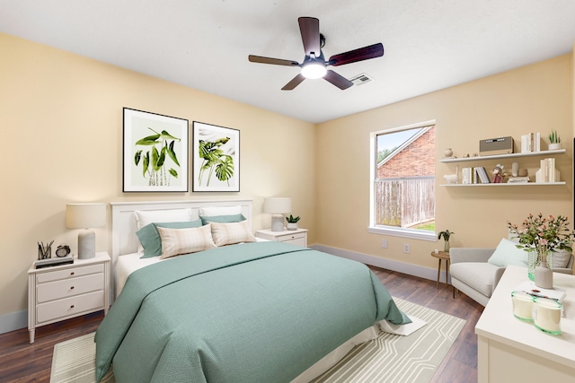 1408 Quail Holw, Sealy, TX 77474 - bedroom with baseboards, dark wood finished floors, and ceiling fan