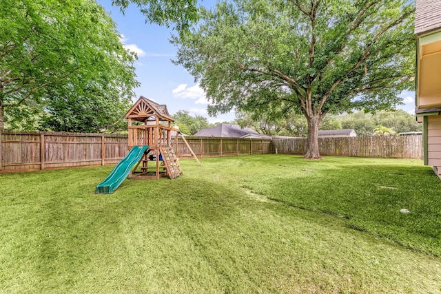 1408 Quail Holw, Sealy, TX 77474 - view of yard with a playground