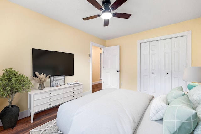 1408 Quail Holw, Sealy, TX 77474 - bedroom with dark wood finished floors, baseboards, a closet, and a ceiling fan