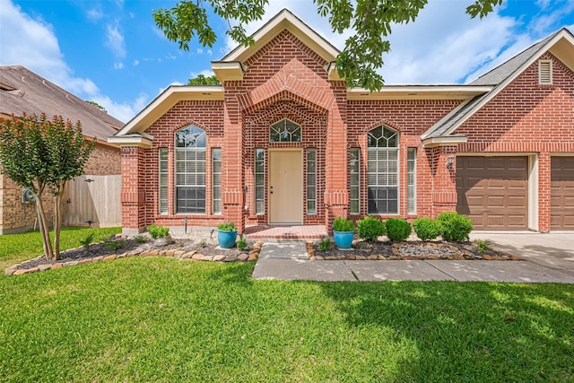 19123 Dee Woods Dr, Humble, TX 77346 - traditional home featuring brick siding, an attached garage, and driveway