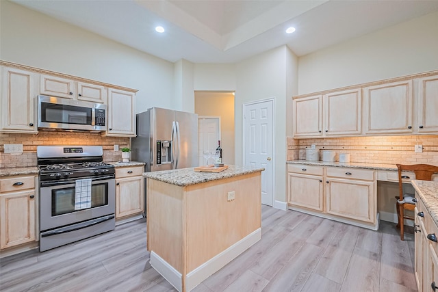 19123 Dee Woods Dr, Humble, TX 77346 - kitchen featuring appliances with stainless steel finishes, tasteful backsplash, light brown cabinets, light wood finished floors, and recessed lighting