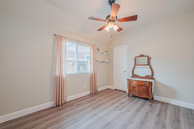 19123 Dee Woods Dr, Humble, TX 77346 - bedroom featuring light wood-type flooring, baseboards, lofted ceiling, and ceiling fan