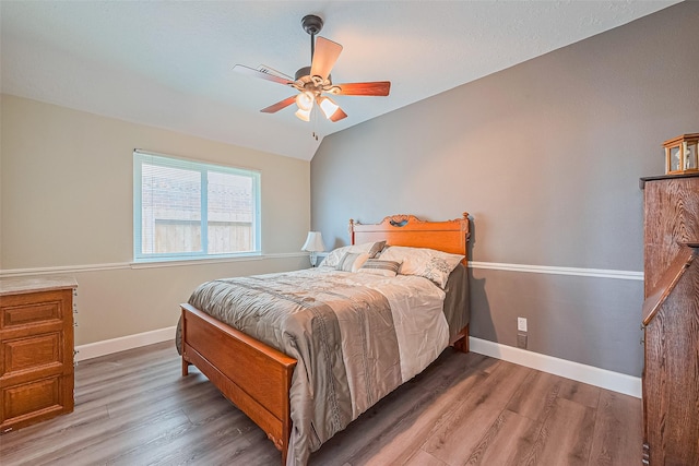 19123 Dee Woods Dr, Humble, TX 77346 - bedroom with wood finished floors, baseboards, and a ceiling fan