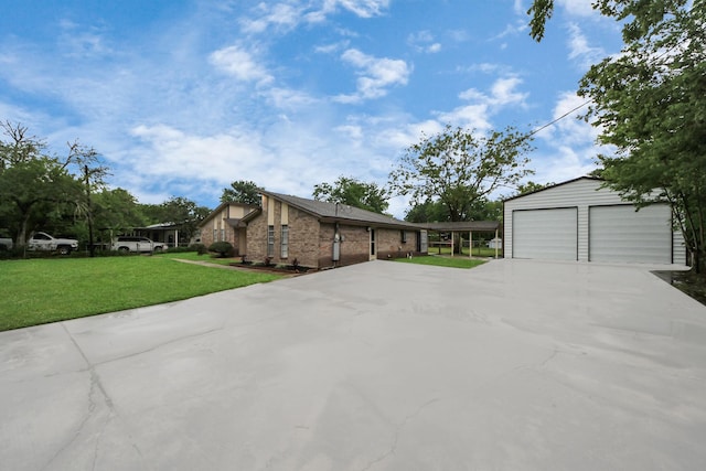 2257 County Road 206, Alvin, TX 77511 - view of front facade featuring a front lawn, an outbuilding, and a garage