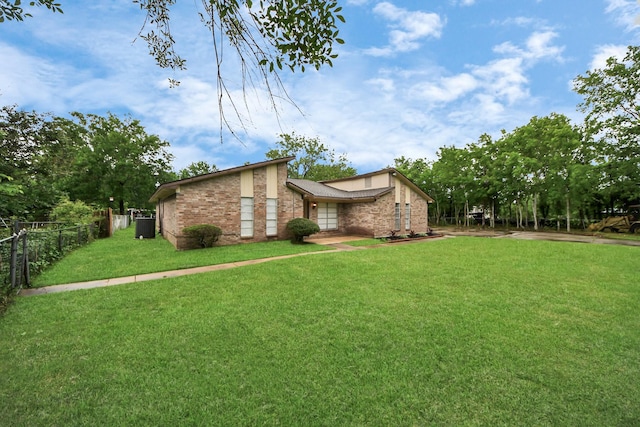 2257 County Road 206, Alvin, TX 77511 - view of front of house featuring brick siding
