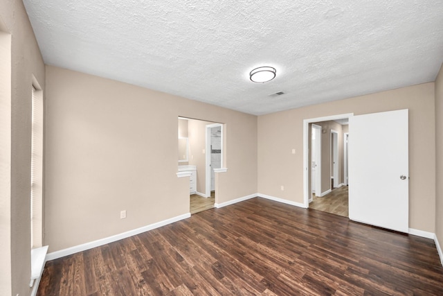 2257 County Road 206, Alvin, TX 77511 - spare room with wood finished floors, baseboards, and a textured ceiling