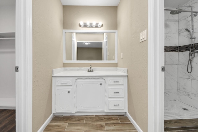 2257 County Road 206, Alvin, TX 77511 - bathroom featuring a shower stall, a textured wall, and baseboards
