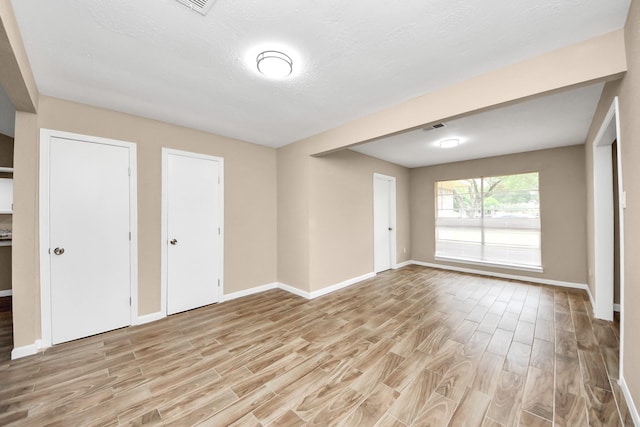 2257 County Road 206, Alvin, TX 77511 - unfurnished bedroom featuring light wood-style floors and baseboards