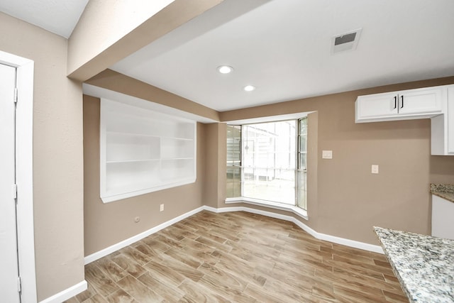 2257 County Road 206, Alvin, TX 77511 - unfurnished dining area with light wood-type flooring, baseboards, and recessed lighting