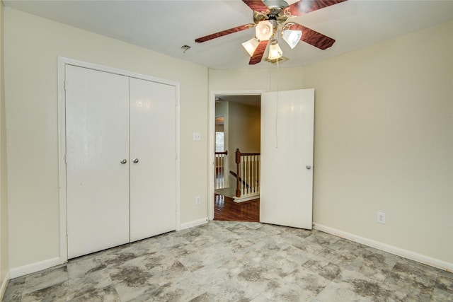 unfurnished bedroom featuring a closet, baseboards, and a ceiling fan