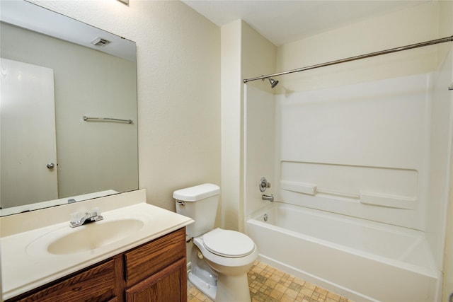 bathroom featuring toilet, vanity, and shower / tub combination