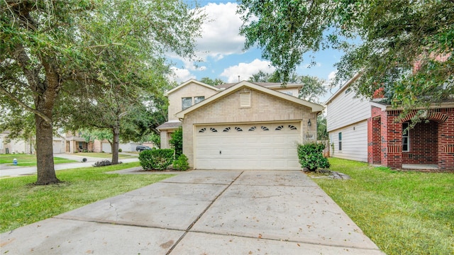 traditional home with a front yard, concrete driveway, and a garage