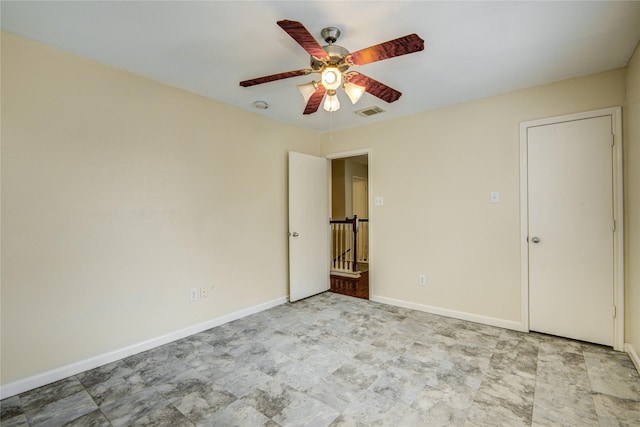unfurnished bedroom featuring baseboards and ceiling fan