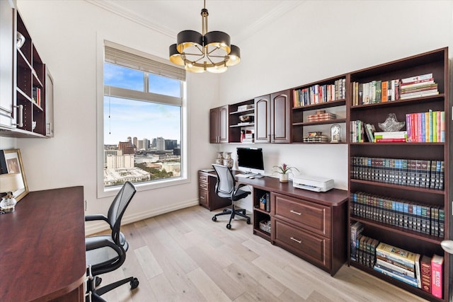 home office featuring a chandelier, light wood-style floors, crown molding, and baseboards
