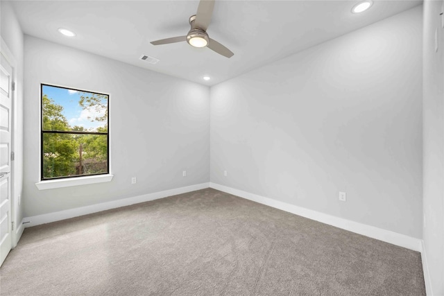 spare room featuring carpet floors, recessed lighting, ceiling fan, and baseboards