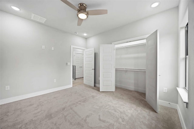 unfurnished bedroom featuring carpet, recessed lighting, a closet, and baseboards