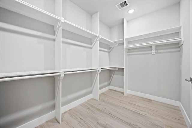 spacious closet with wood finished floors