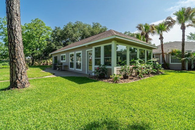 104 Smith Ln, League City, TX 77573 - back of property featuring a lawn and a patio area
