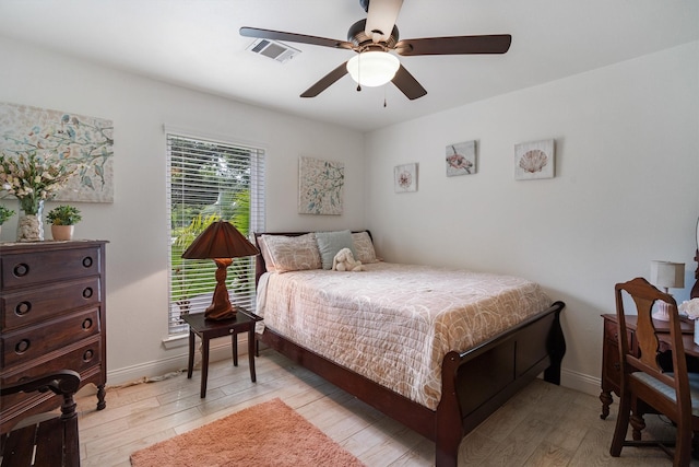 104 Smith Ln, League City, TX 77573 - bedroom featuring light wood-type flooring, baseboards, and ceiling fan