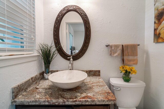 104 Smith Ln, League City, TX 77573 - bathroom featuring vanity and toilet