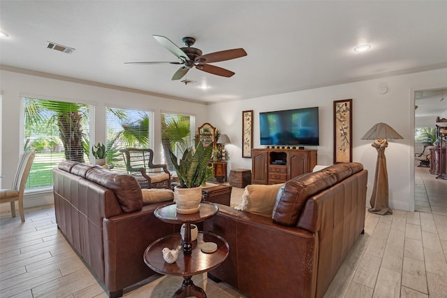 104 Smith Ln, League City, TX 77573 - living room featuring ceiling fan, light wood-type flooring, crown molding, baseboards, and recessed lighting