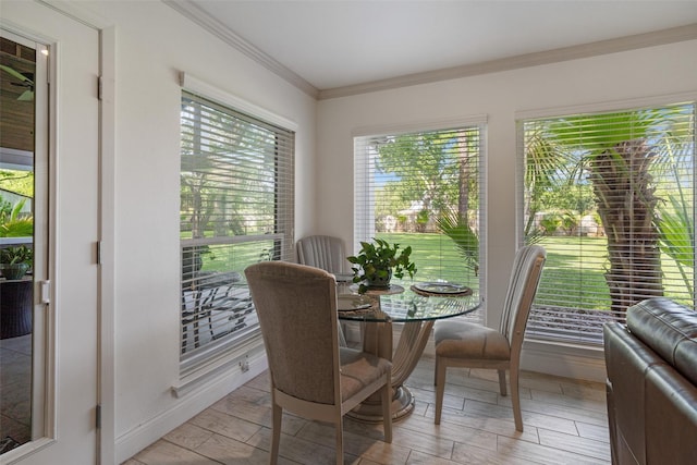 104 Smith Ln, League City, TX 77573 - dining space featuring plenty of natural light, crown molding, and light wood-style floors