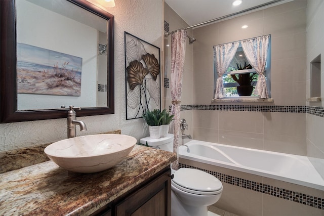 104 Smith Ln, League City, TX 77573 - bathroom featuring toilet, a textured wall, vanity, and shower / bath combo with shower curtain
