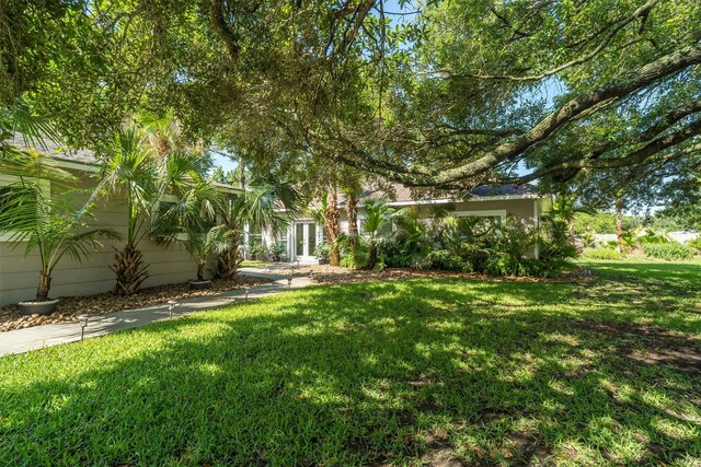 104 Smith Ln, League City, TX 77573 - view of green lawn featuring french doors